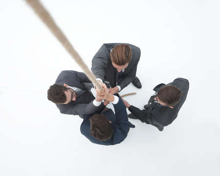 smiling business team holding the ropeの写真素材