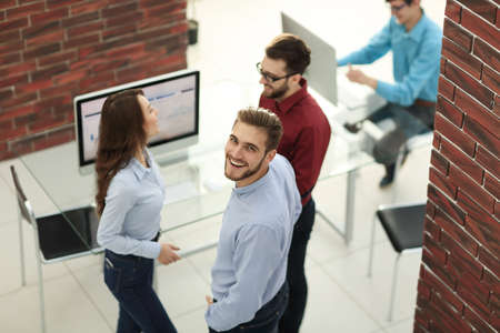 Creative business people listening to young man explanations.の写真素材