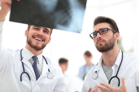 two doctors looking at x-ray.の写真素材