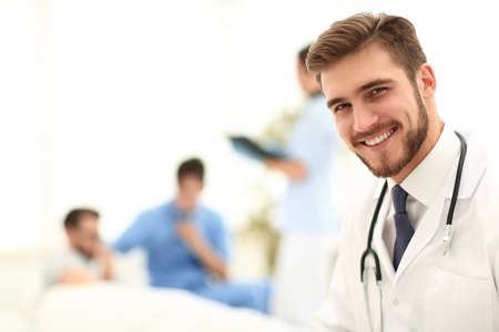 closeup.smiling doctor on blurred background.の写真素材