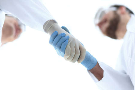 closeup.two scientists shake hands.の写真素材