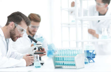 biologist explores the substance under the microscopeの写真素材