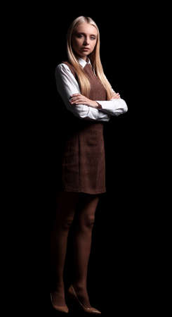 successful young business woman. isolated in the dark. photo in full growthの写真素材