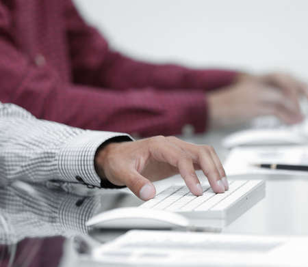 closeup of employees typing on the keyboardの写真素材