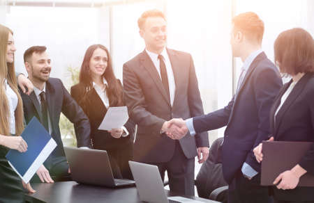 handshake business partners at a meeting in the officeの写真素材