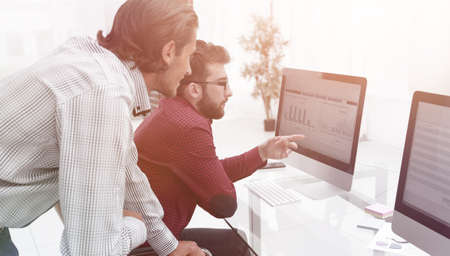 colleagues discussing financial dataの写真素材