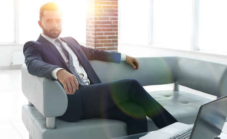 businessman sitting in the lobby of a modern office.の写真素材