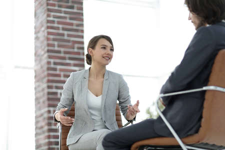A relaxed conversation of a man and a woman in the officeの写真素材