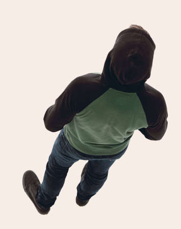 view from above. Hipster in a jacket with a hood looking downの写真素材