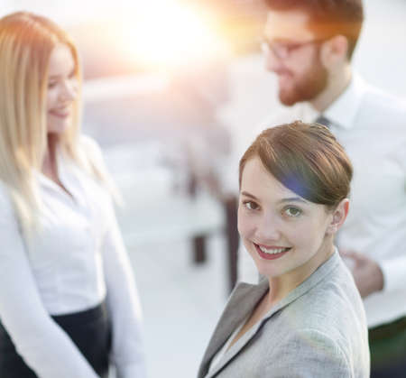 confident business woman on blurred background office.の写真素材