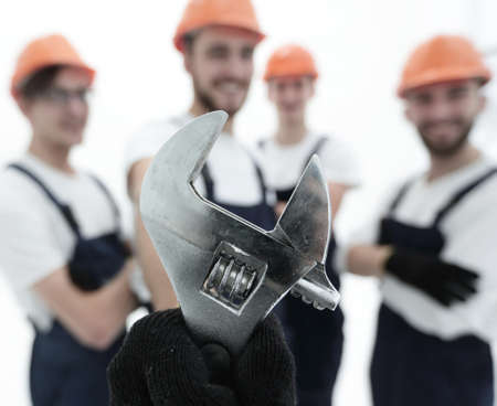 closeup. the wrench in the hands of the buildersの写真素材