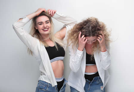 two young female models standing next to each otherの写真素材