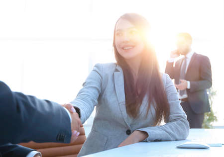 female consultant greeting the customer .