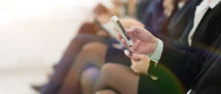 closeup of colleagues sitting at a business conference.の写真素材