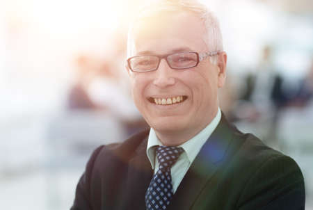 close up portrait of senior businessman in officeの写真素材