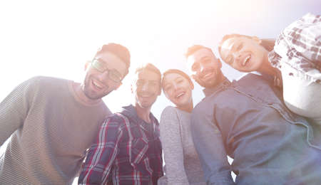 bottom view.team of friends looking at the camera.の写真素材