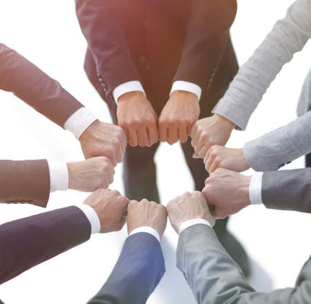 closeup.business people show a circle of hands.