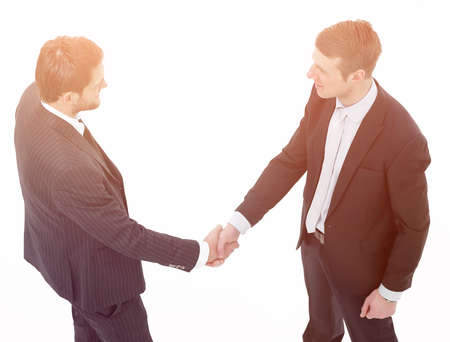 in full growth.handshake, business partners ,isolated on white background.の写真素材