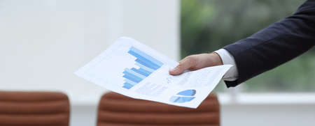 Business people discussing financial graphsの写真素材