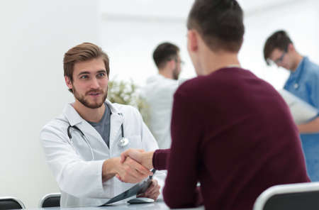 handshake between doctor and patientの写真素材