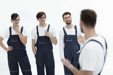 cheerful team of responsible movers and their smiling leader.の写真素材