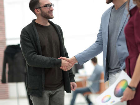 closeup.the handshake between the designer and the clientの写真素材