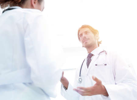 Two Doctors Having Meeting In Hospital Reception Areaの写真素材