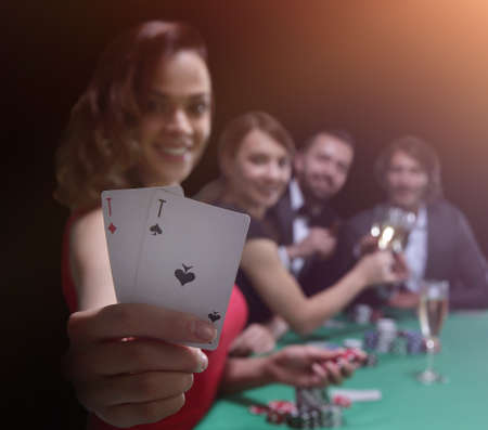adult group celebrating friend winning blackjack