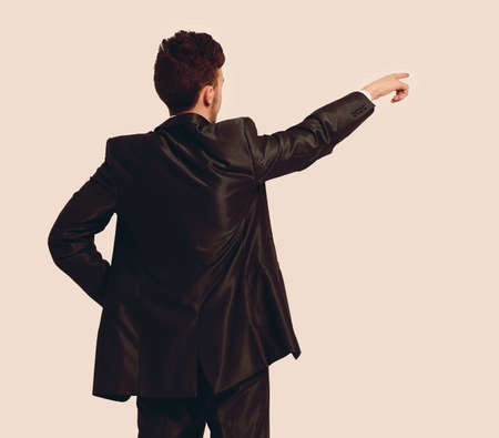 Full length of business man pointing at copyspaceの写真素材