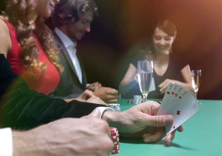 Closeup of poker hand of aces in pastel colorsの写真素材