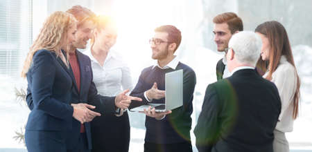 successful business team discussing documents and ideas standingの写真素材