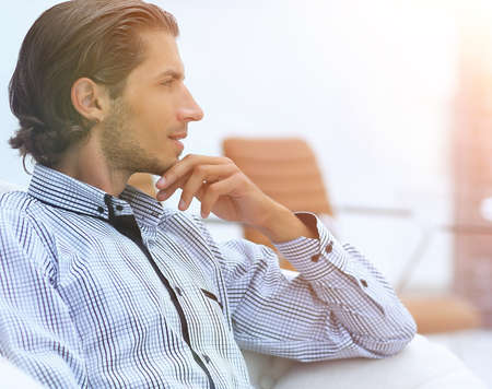 businessman sitting in a chair in the lobbyの写真素材