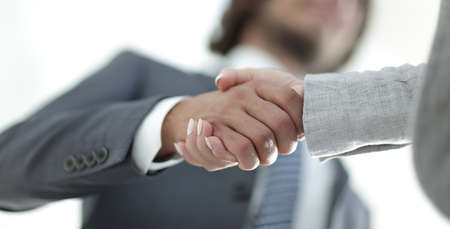 Businessmen handshaking after successful business meetingの写真素材