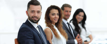 group of business people sitting at the desktopの写真素材