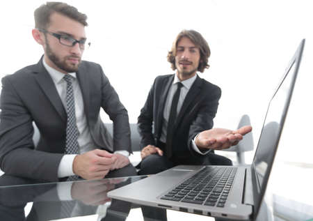 Two businessmen working on a project togetherの写真素材