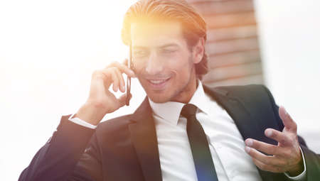 business man talking on smart phone.