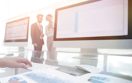 close-up of a business woman working with financial chartsの写真素材