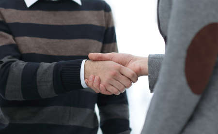 closeup of a business handshake colleagues.