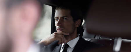 businessman sitting in his car.の写真素材