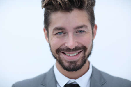 Serious businessman wearing suit and tie. blue backgroundの写真素材