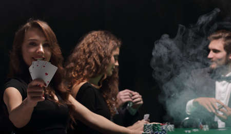 smiling woman with the winning combination of cardsの写真素材