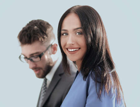 cheerful business couple looking at file indoors.