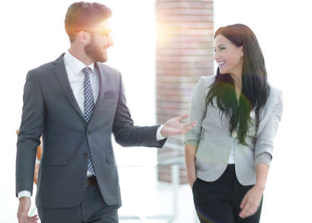 employees of the company discuss working issues standing in the officeの写真素材