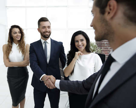 handshake of business people on the background of the officeの写真素材