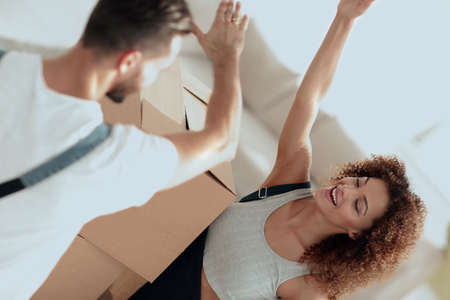 young couple giving five when moving to a new apartment