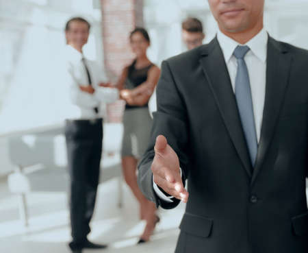 successful businessman giving a handの写真素材