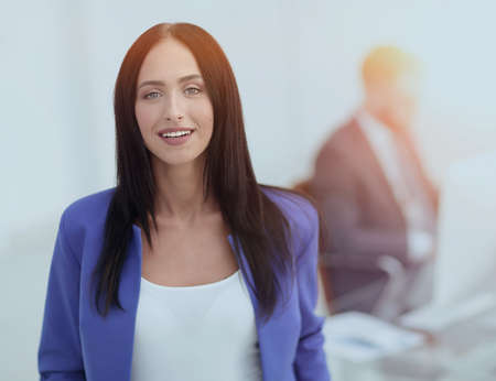 Young brunette businesswoman girl looking at camera