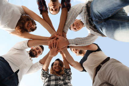 business team with hands clasped togetherの写真素材