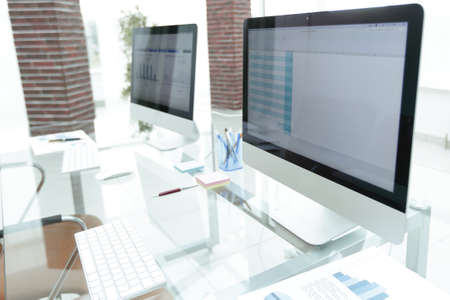 stylish workplace with computer in modern officeの写真素材