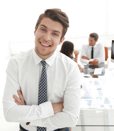 successful businessman on background of office.